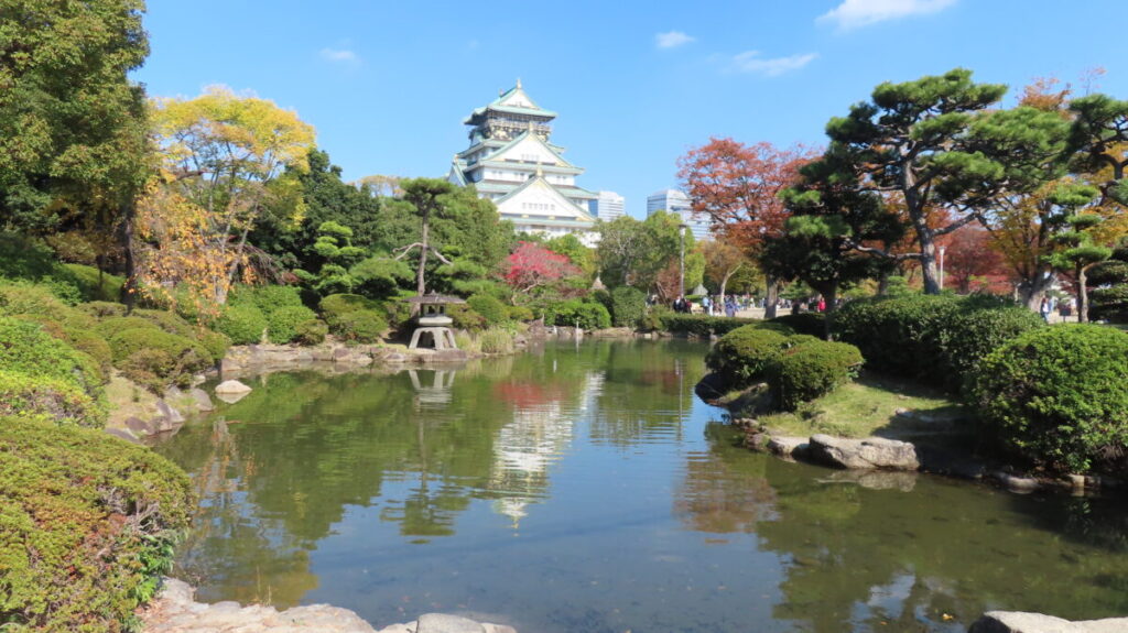 Upside-down reflection of Osaka Castle on the pond