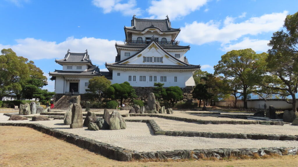 Exterior of Kishiwada Castle tower against a blue sky