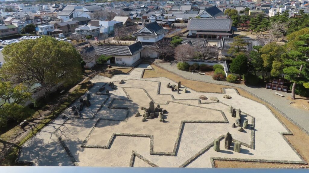 Panoramic view of Hachijin-no-niwa from the castle keep showing geometric patterns
